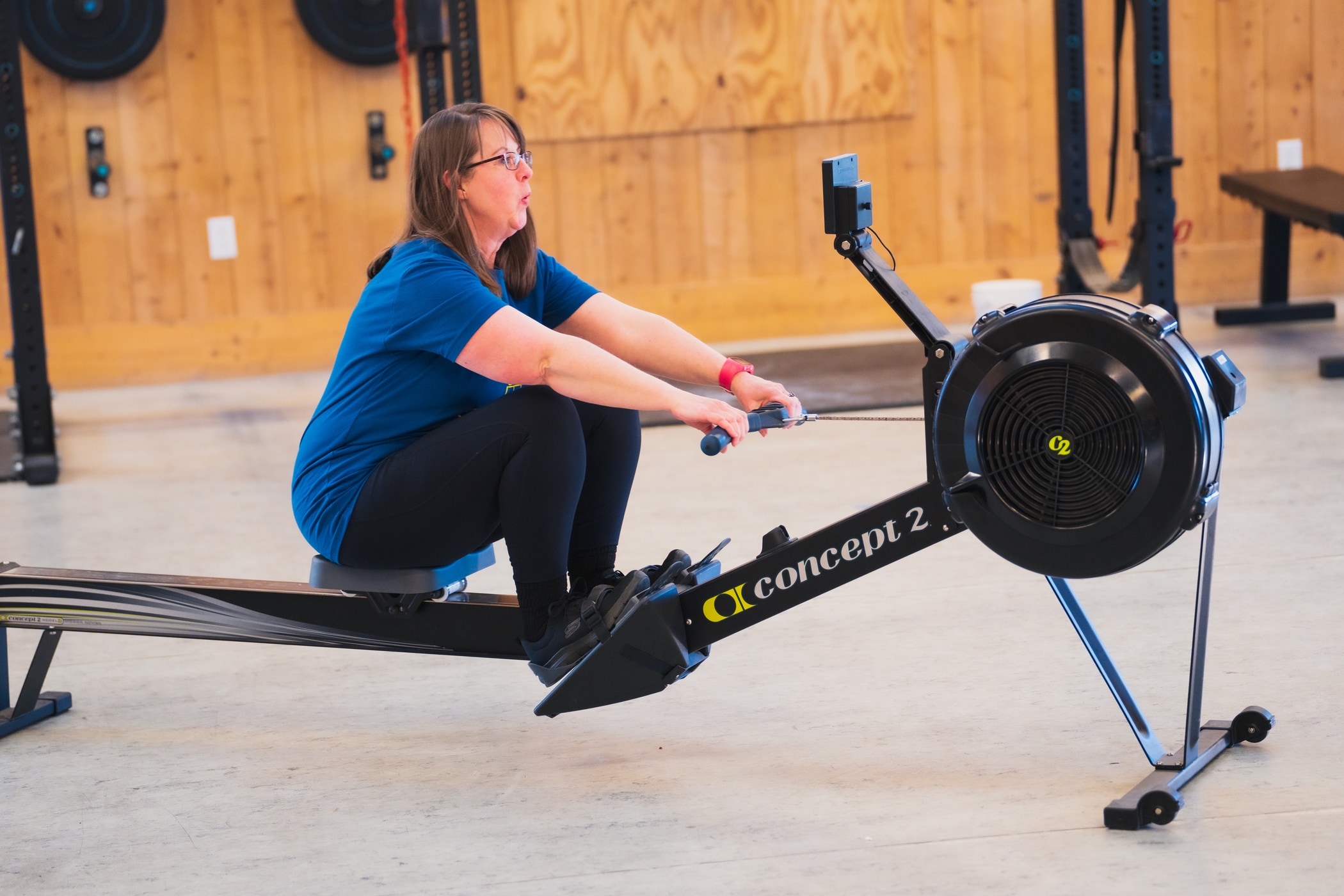 Photo of a woman rowing on a Concept2 RowErg
