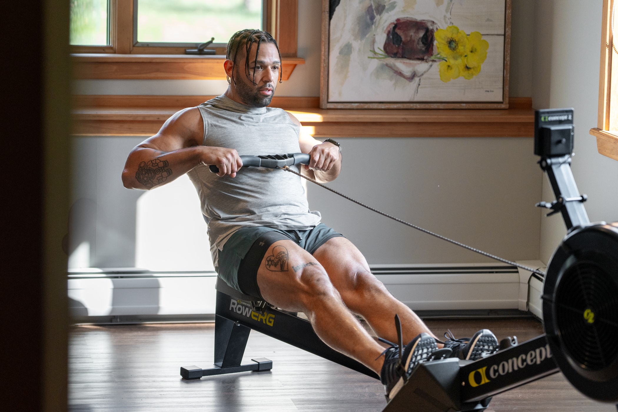Man on the RowErg at home