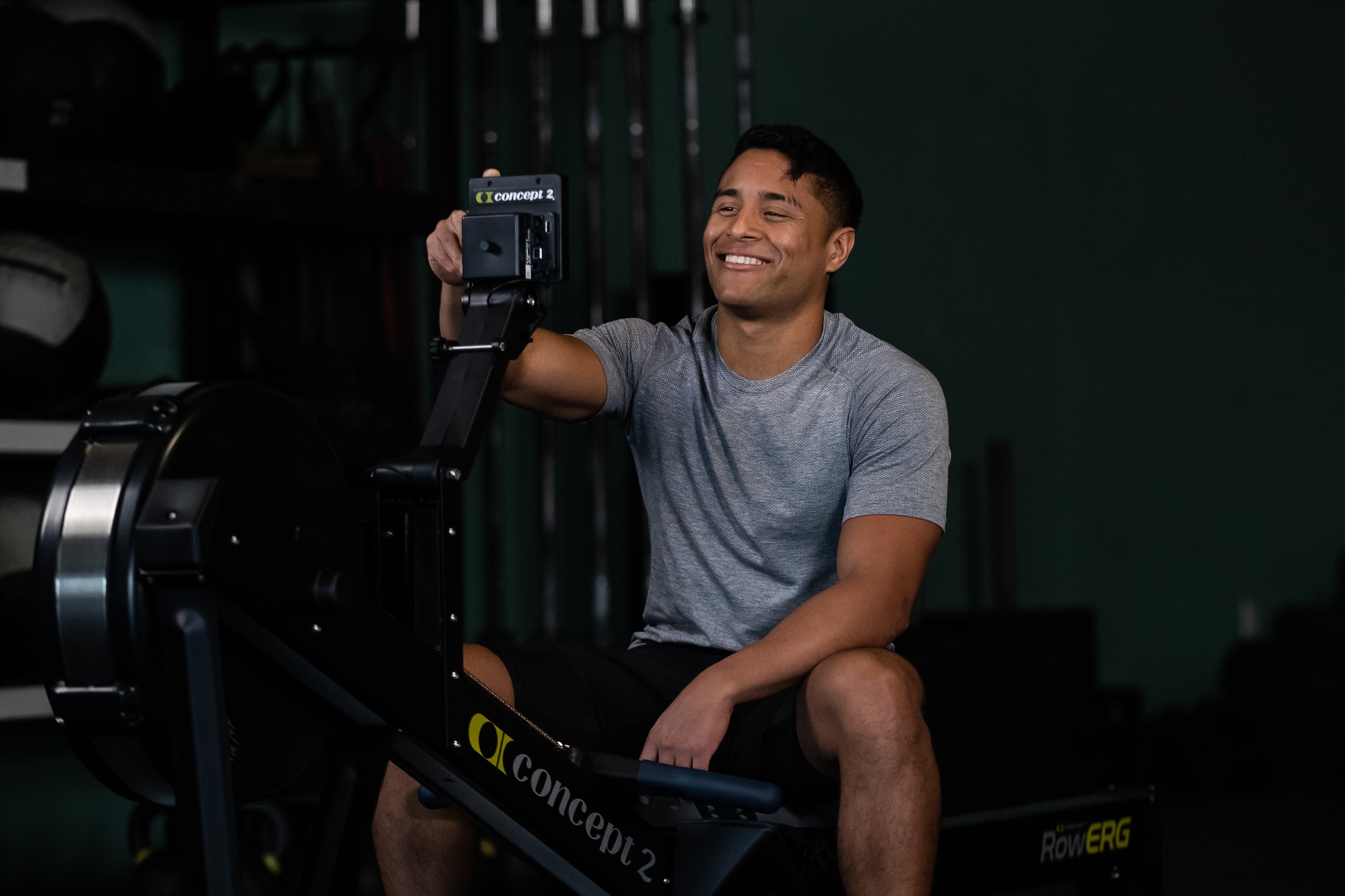 Man using a PM5 on a Concept2 RowErg