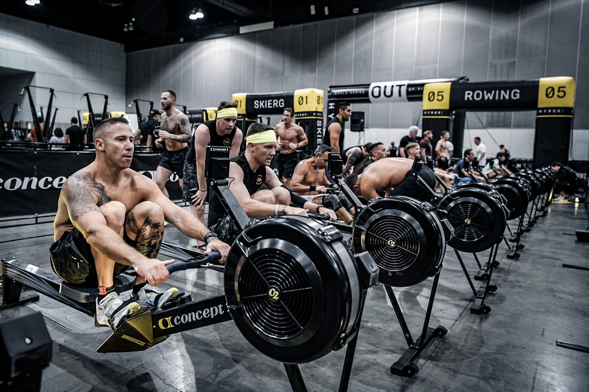 Men on RowErg in Hyrox competition