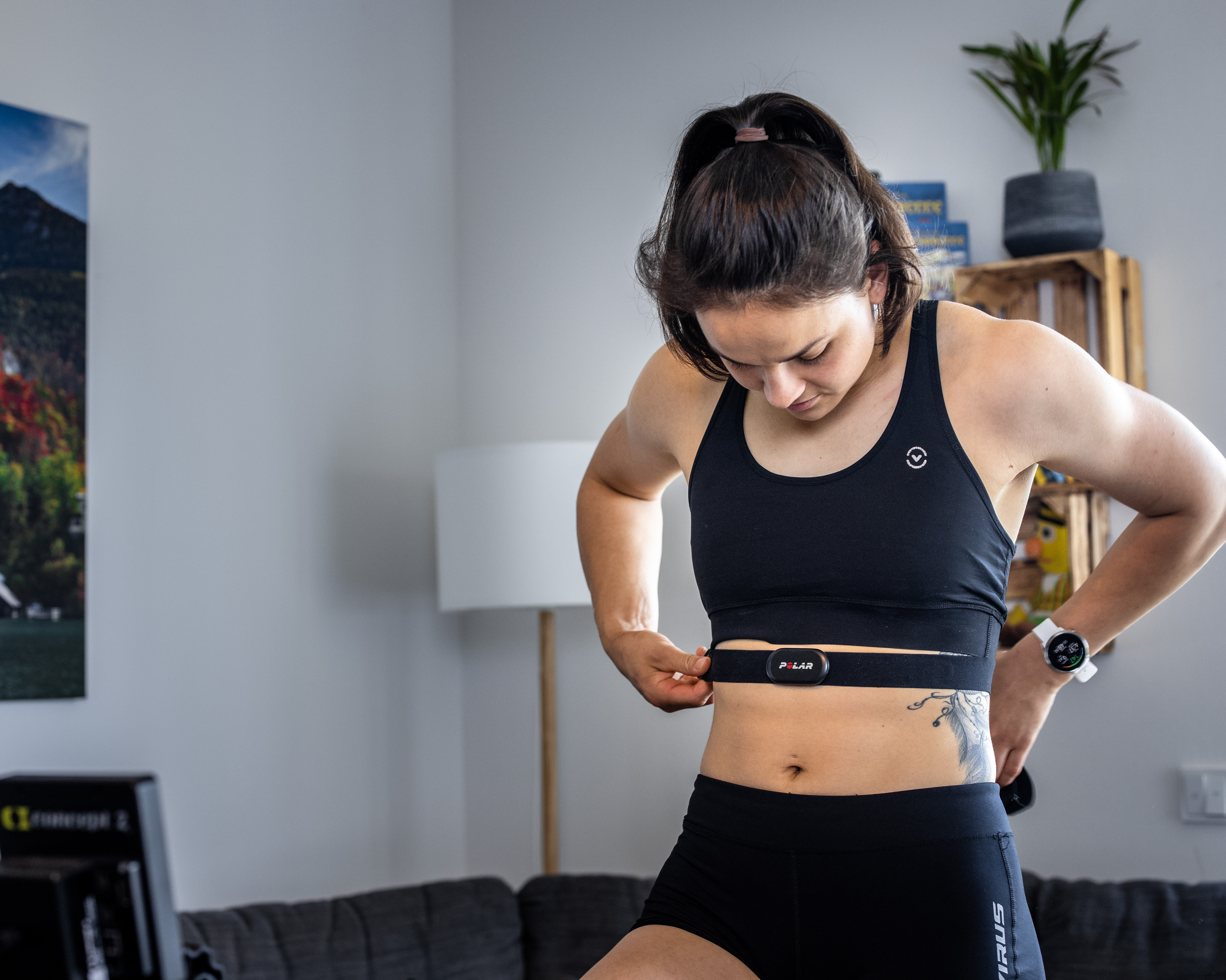 Female Rower Putting on Heart Rate Belt